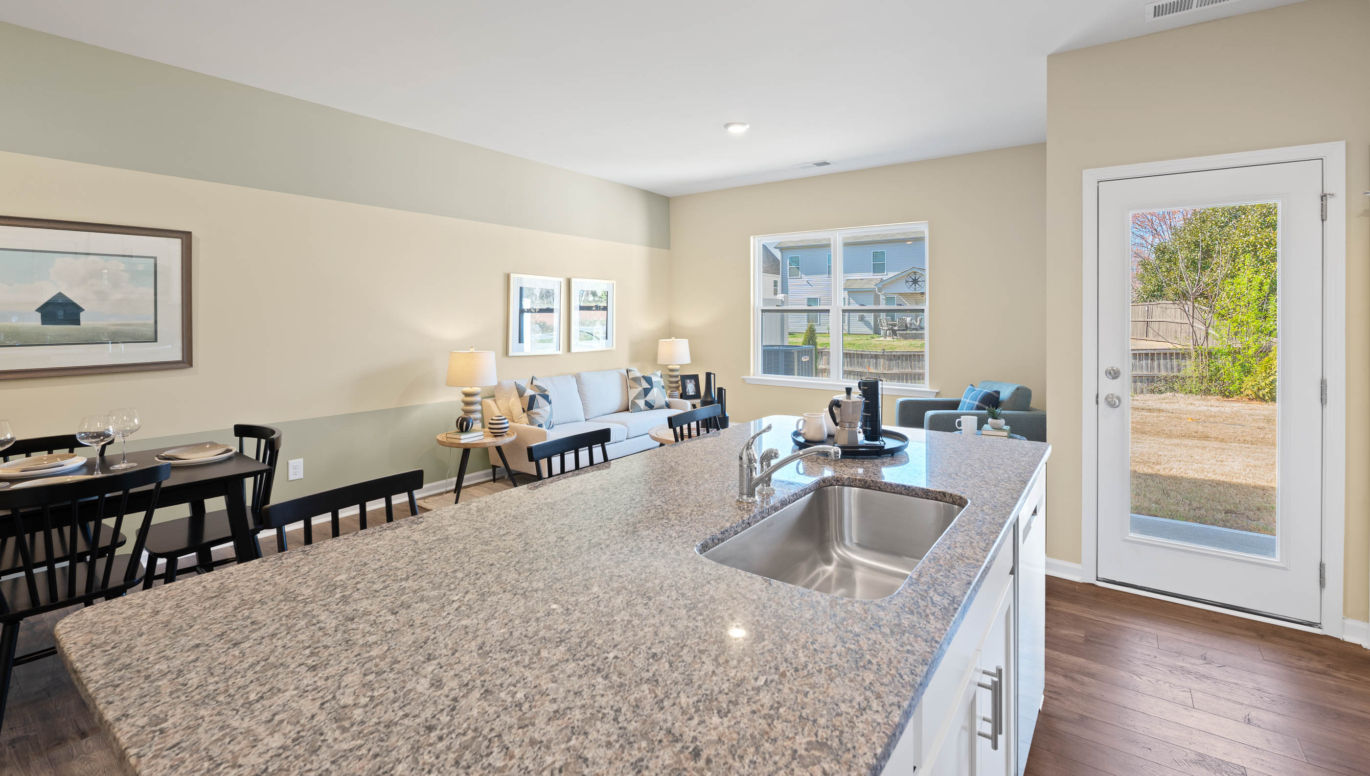 Kitchen with island and granite countertops.