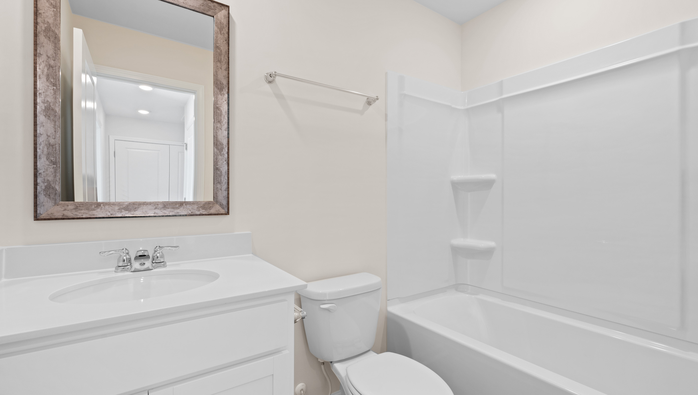 Bathroom with vanity and tub.