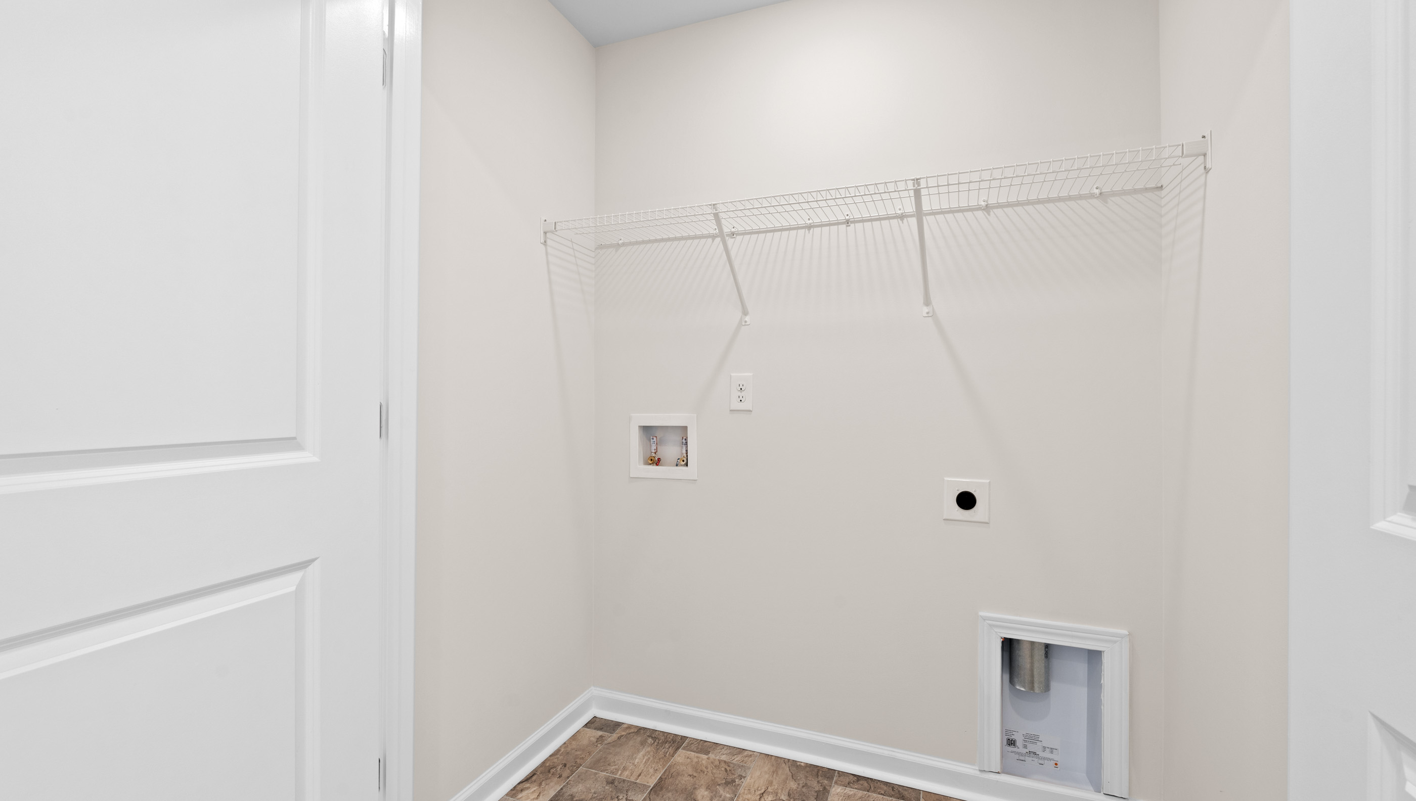 Laundry closet with shelves.