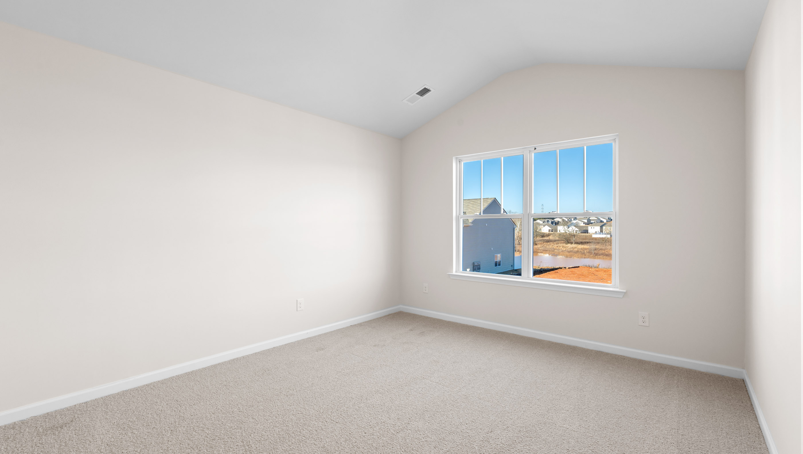 Bedroom with carpet and window,