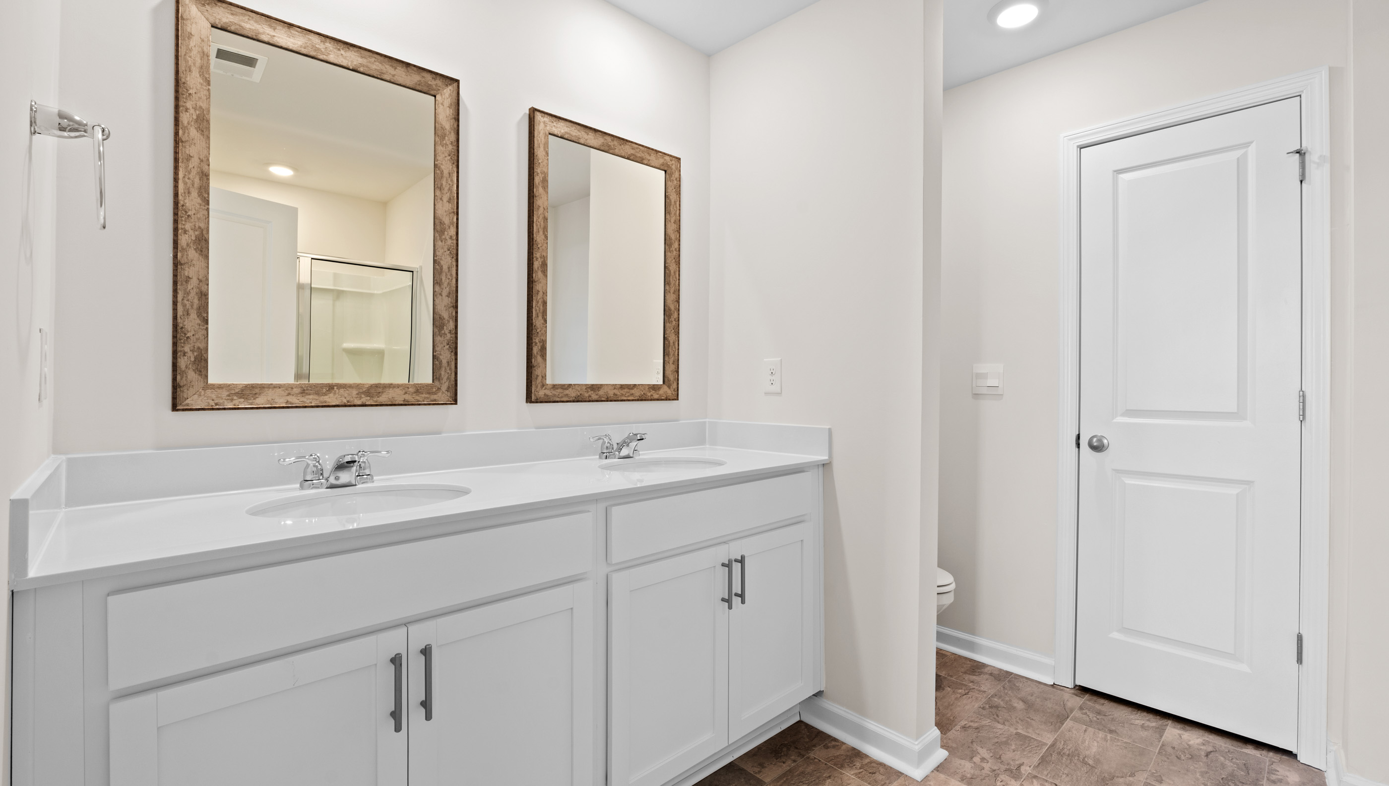 Bathroom with dual vanity.