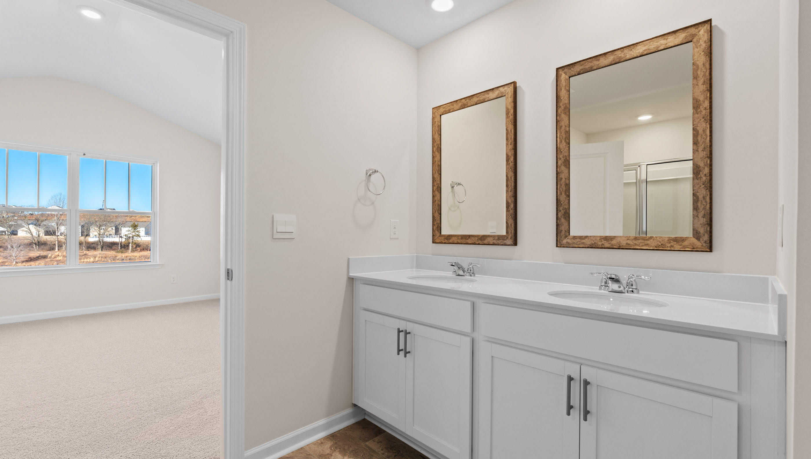 Bathroom with dual vanity.