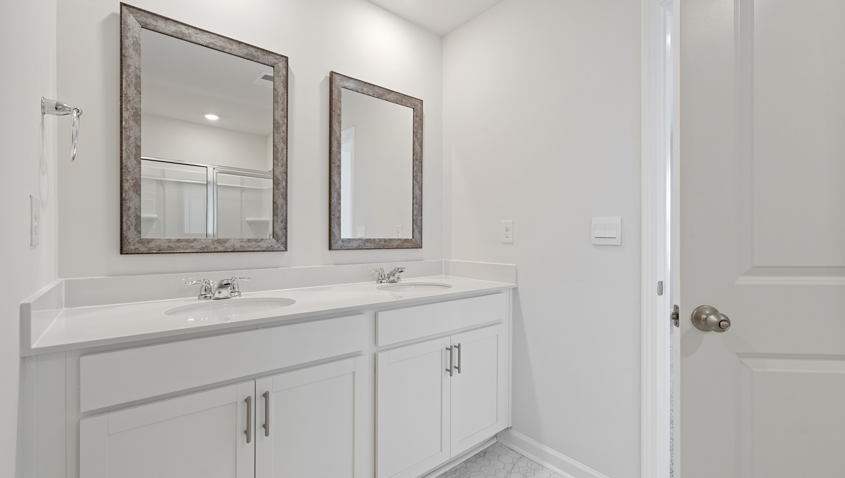 Bathroom with dual vanity.