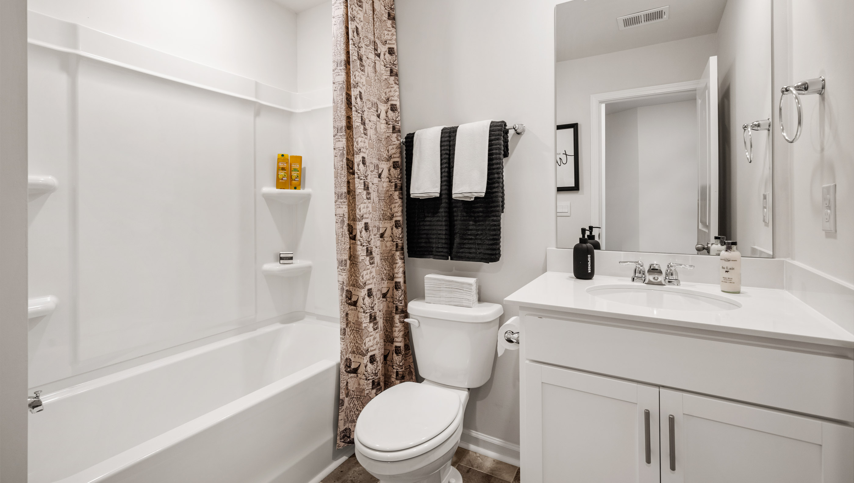 Bathroom with toilet and bathtub.