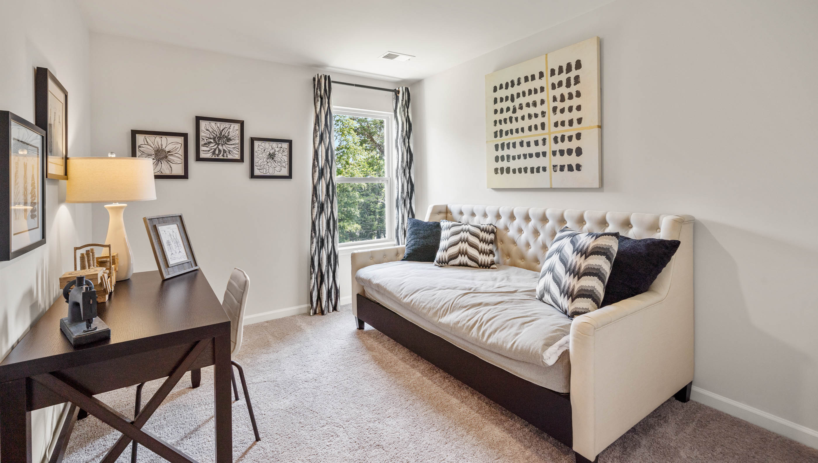 Bedroom with carpet and window.
