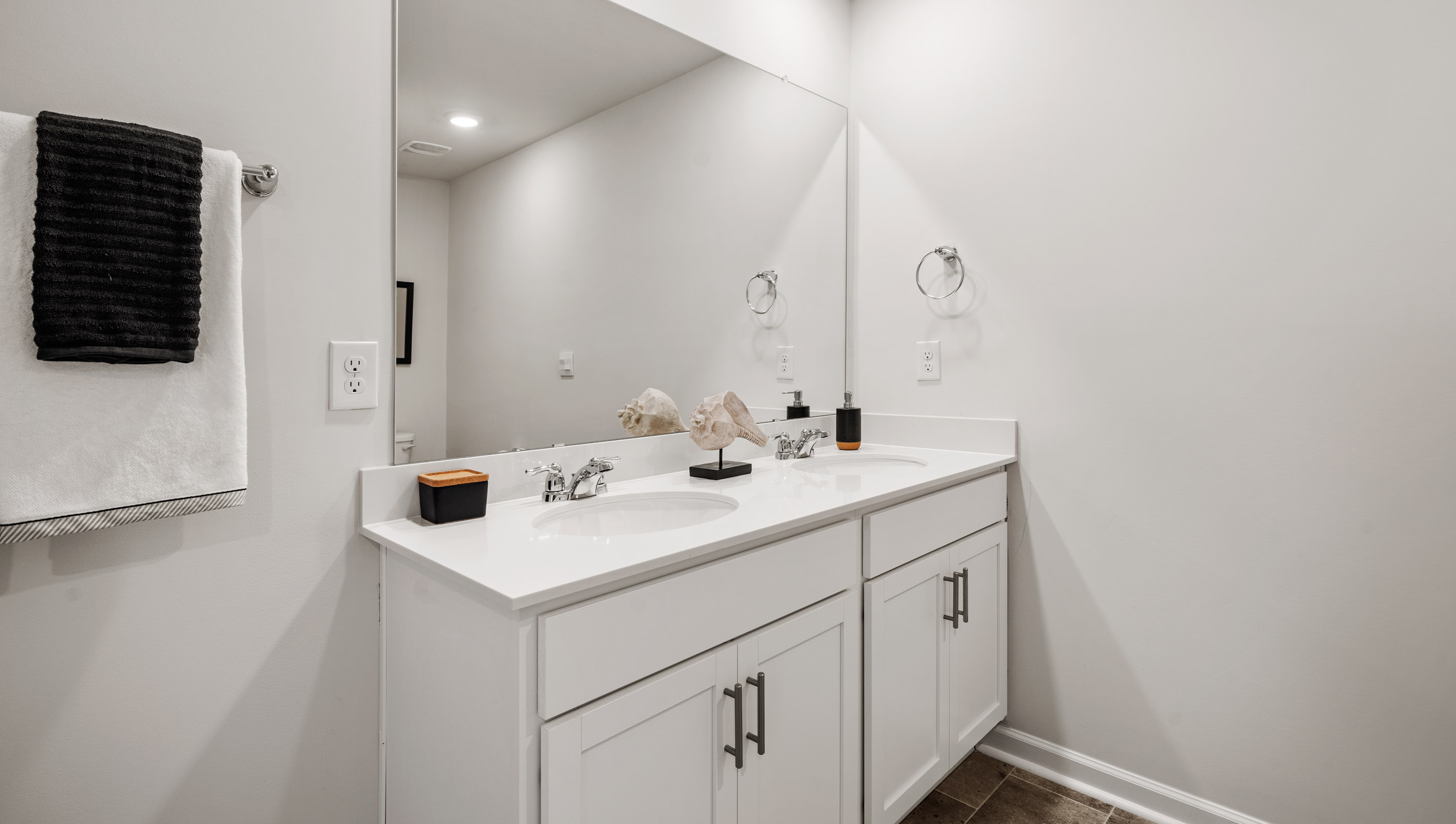 Primary bathroom with double vanity sink.