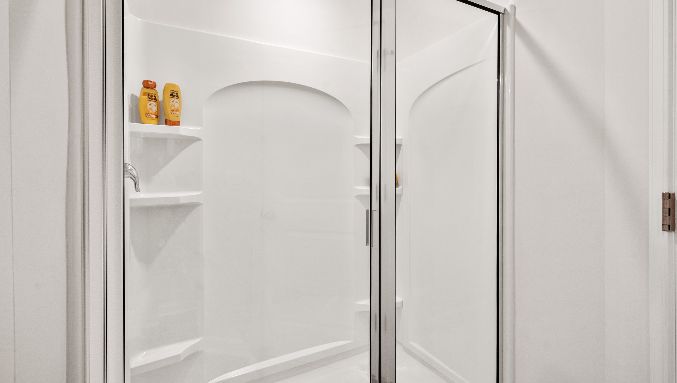 Bathroom with walk in shower.