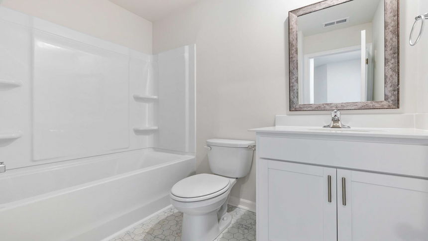 Bathroom with tub and vanity.