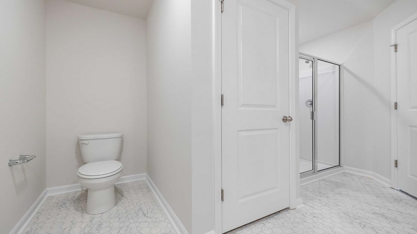 Bathroom with walk in shower.