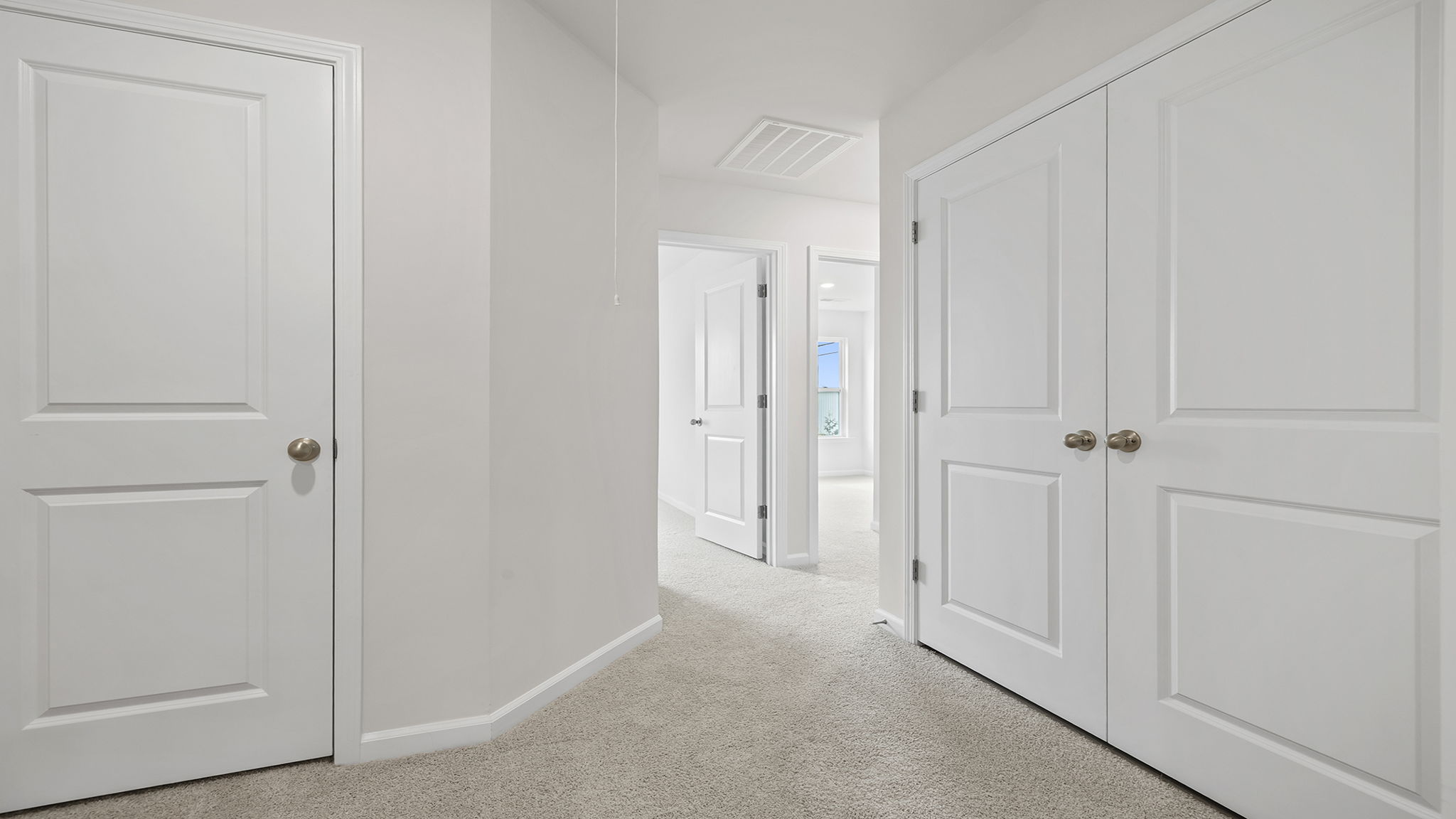 Bedroom with carpet and window.