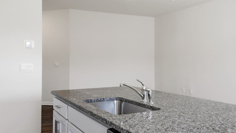 Kitchen with island and window.