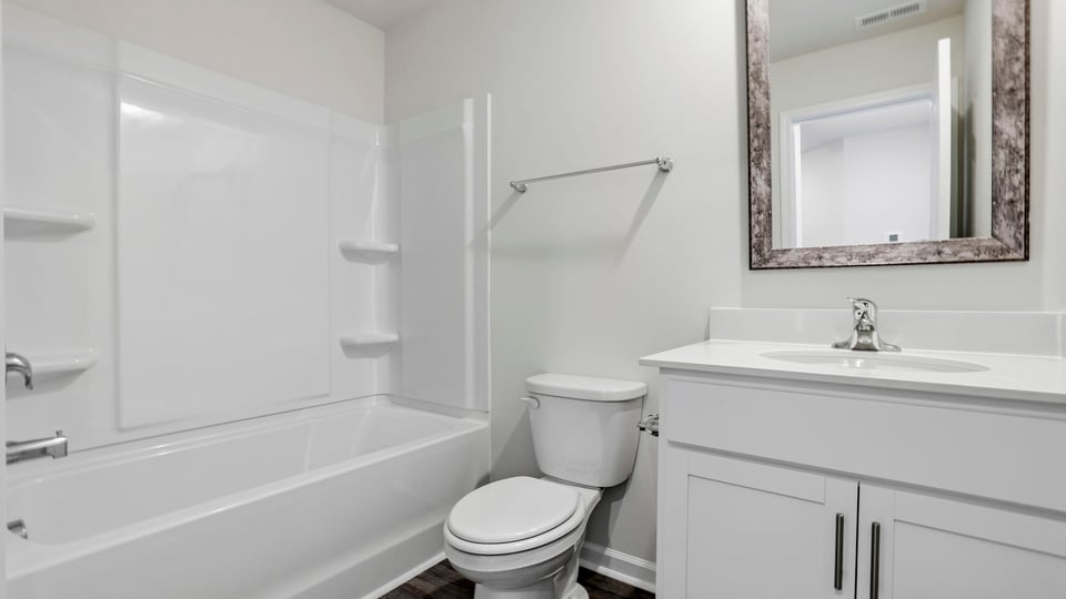 Walk in bathroom with vanity.