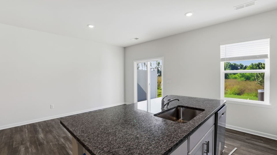 Kitchen with island and windows.