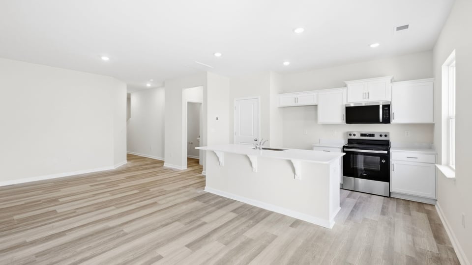 Livingroom with view of kitchen.