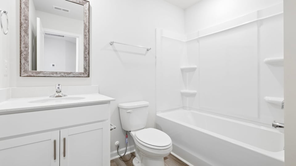 Bathroom with vanity and tub.