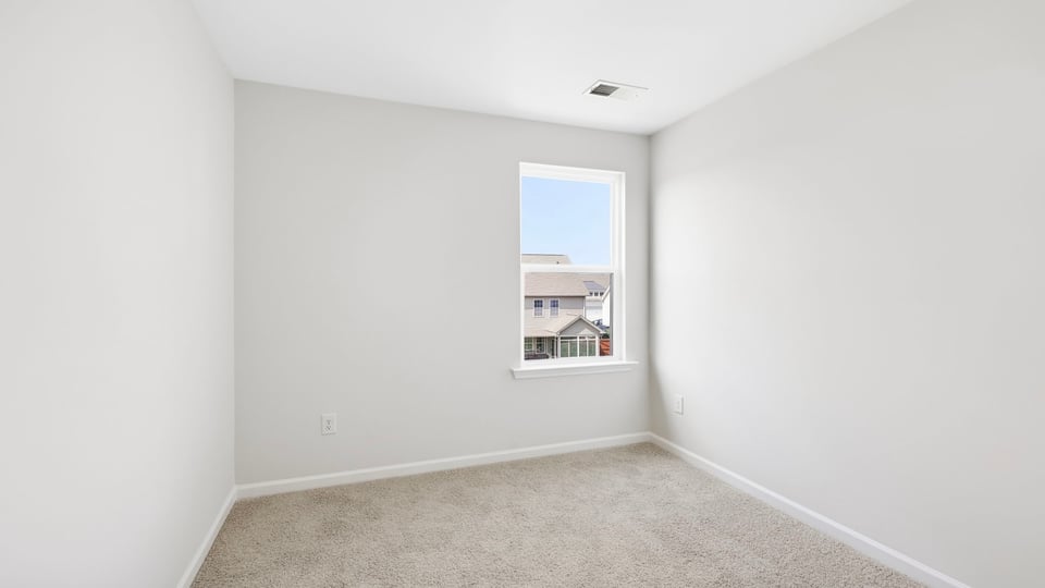 Bathroom with carpet and window.