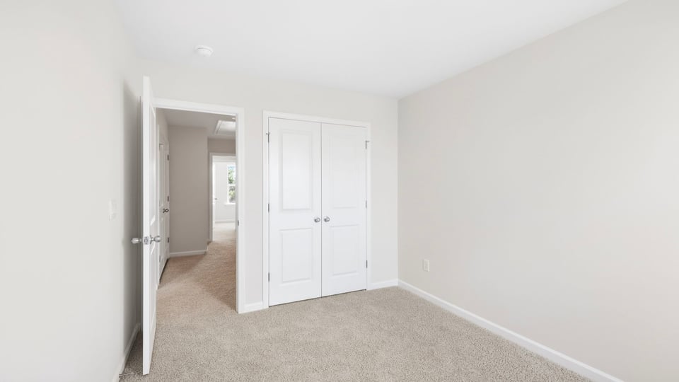 Bathroom with carpet and window.