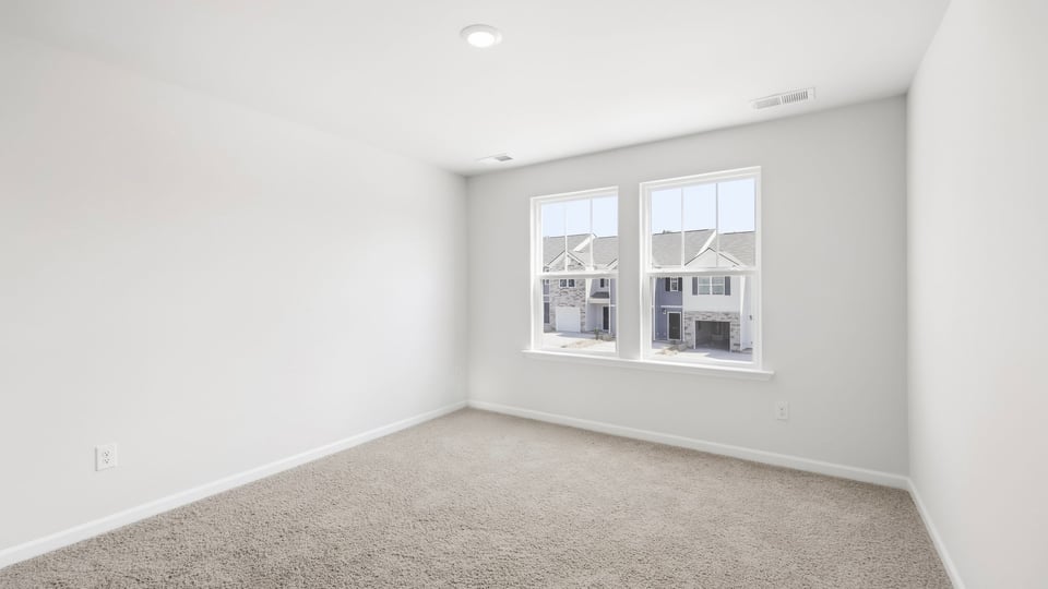 Bathroom with carpet and window.