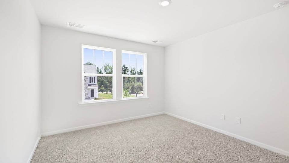 Bathroom with carpet and window.
