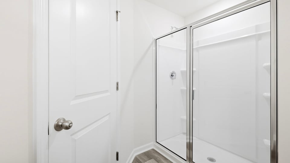 Bathroom with walk in shower.