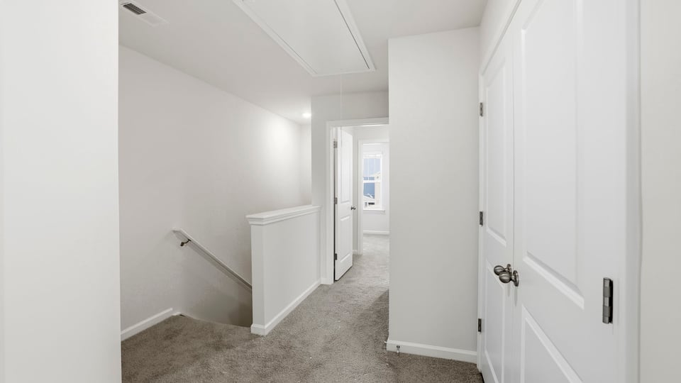 Bedroom with carpet and window.