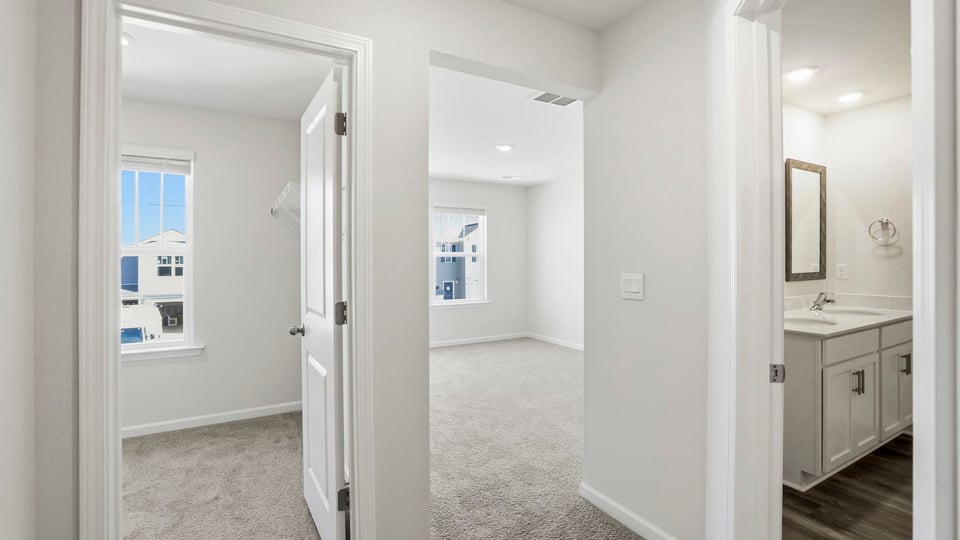 Bedroom with carpet and window.