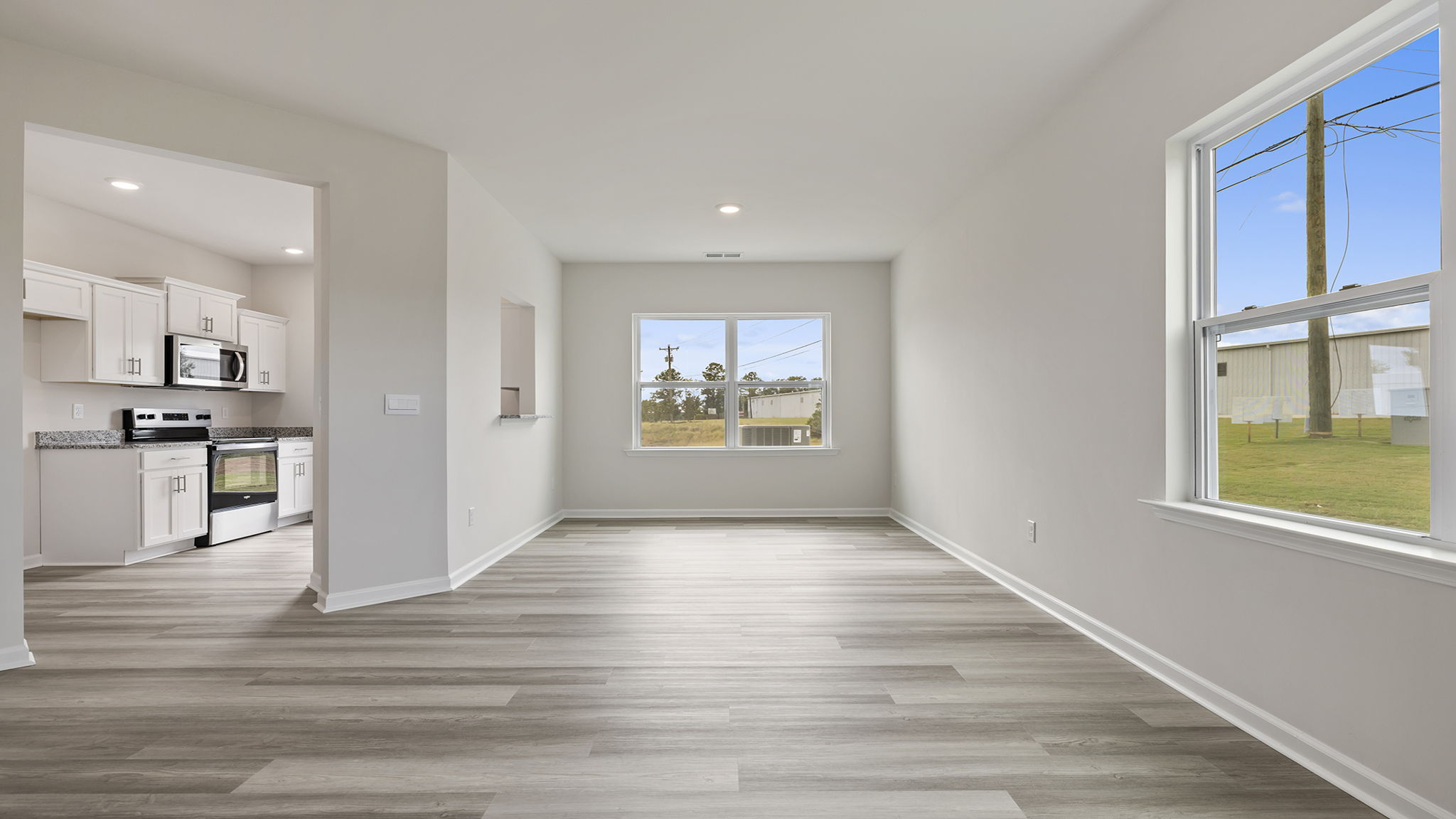 Livingroom with kicthen and windows.