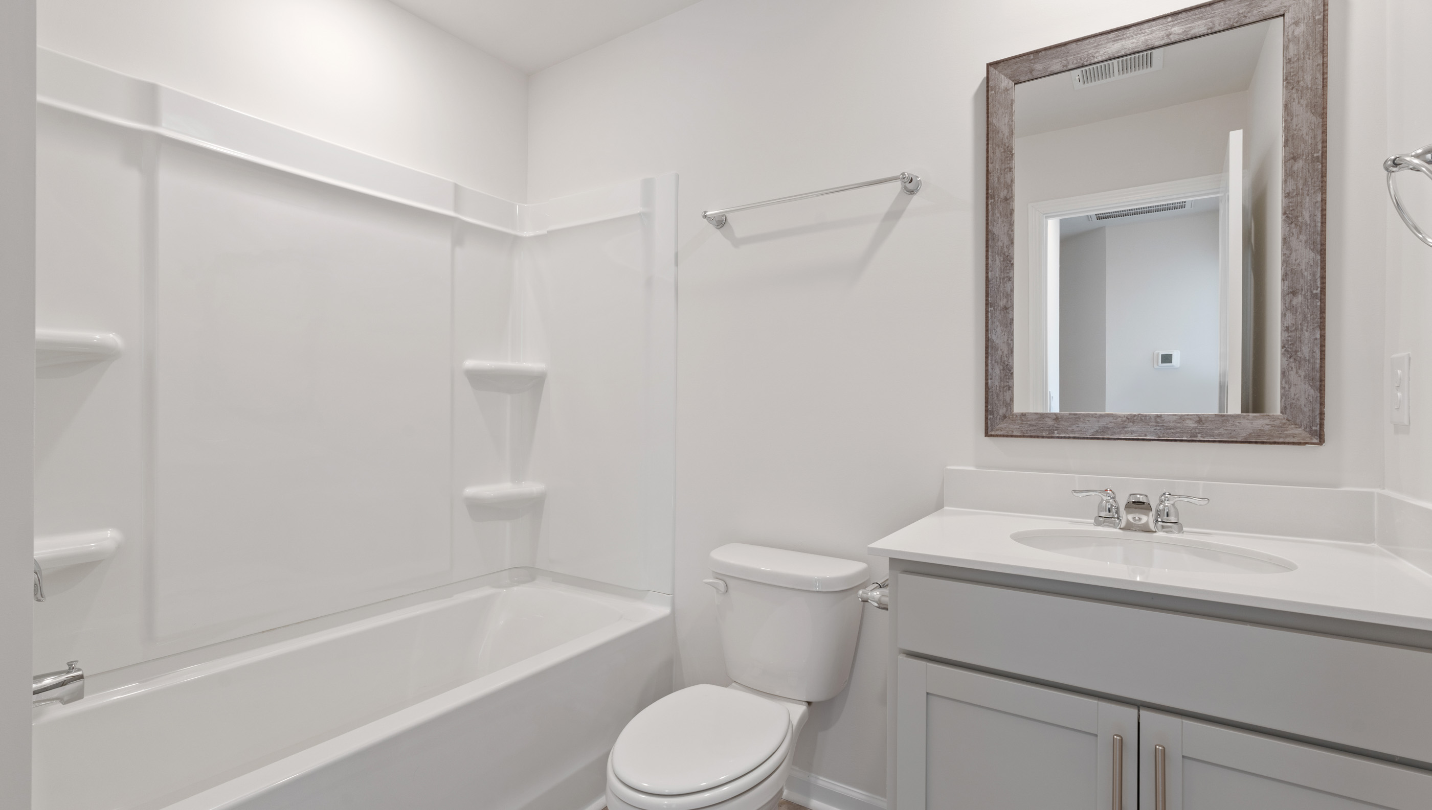 Bathroom with vanity and tub.