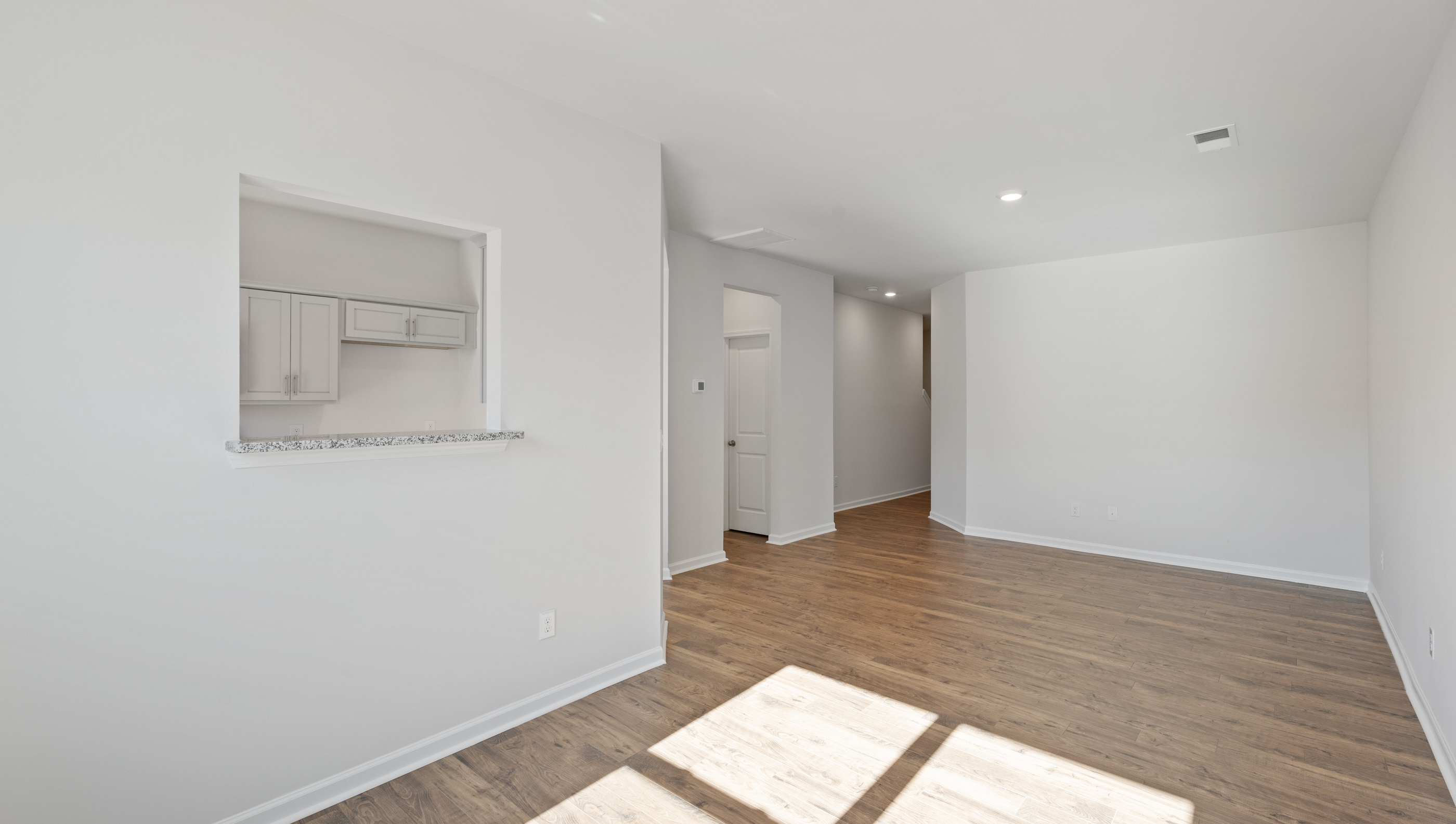 Dining room looking towards front of home.