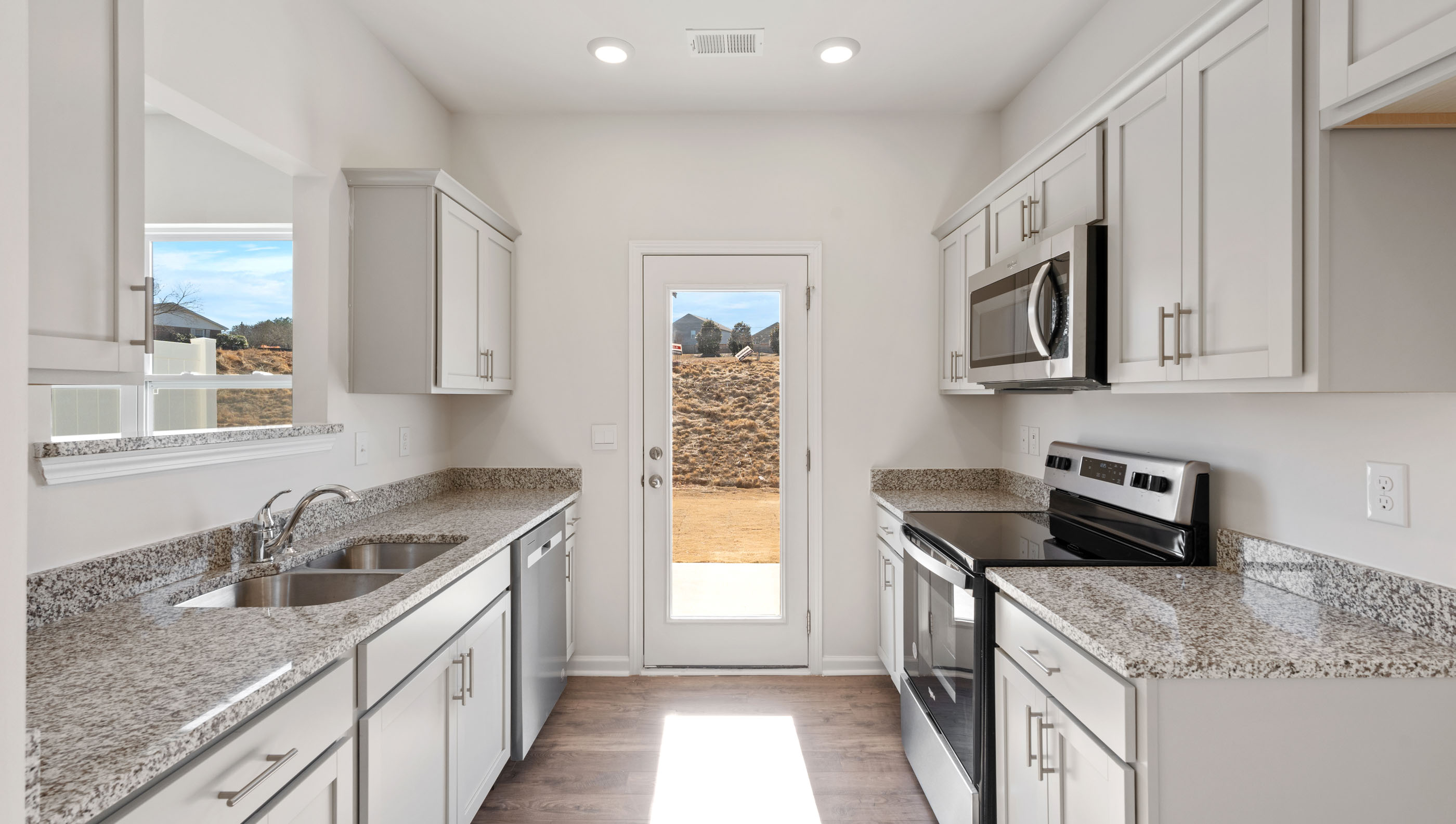 Kitchen with granite countertops and stainless steel appliances.