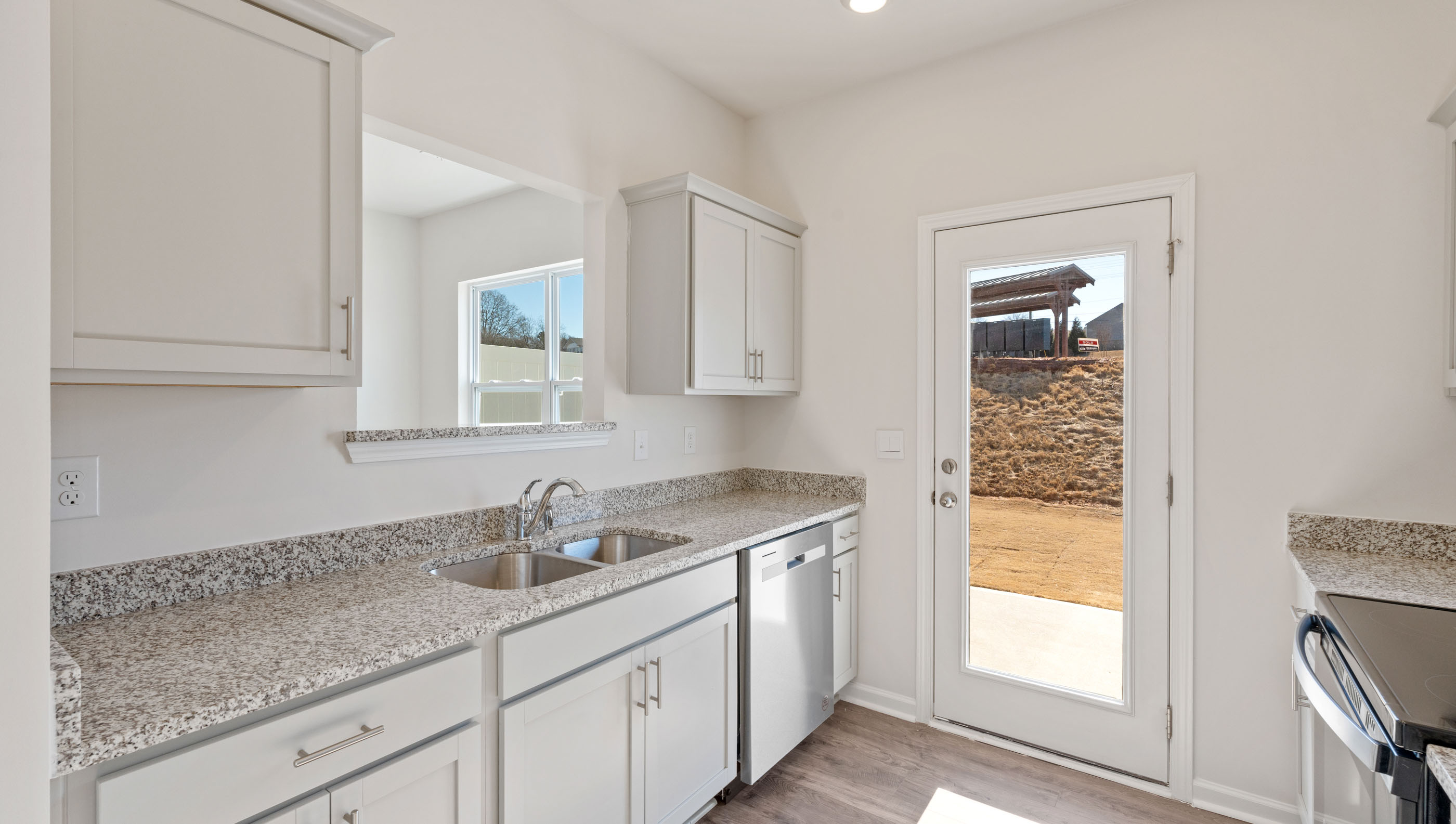 Kitchen with granite countertops and stainless steel appliances.