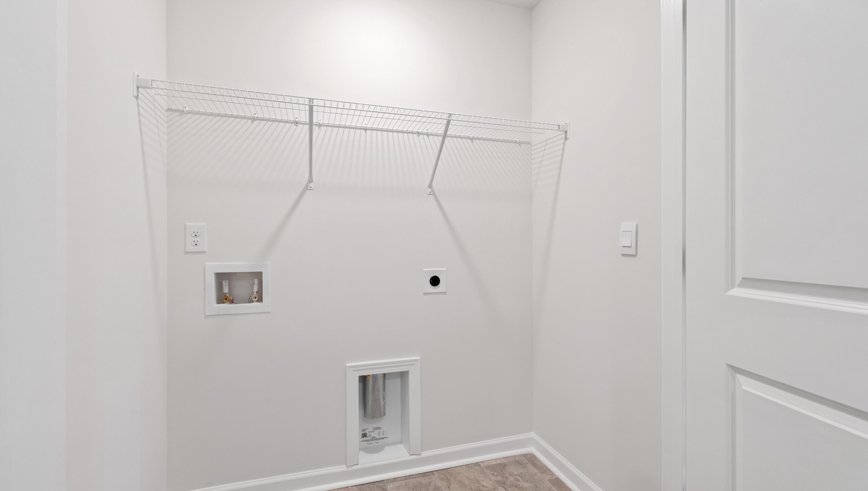 Closet laundry with shelves.