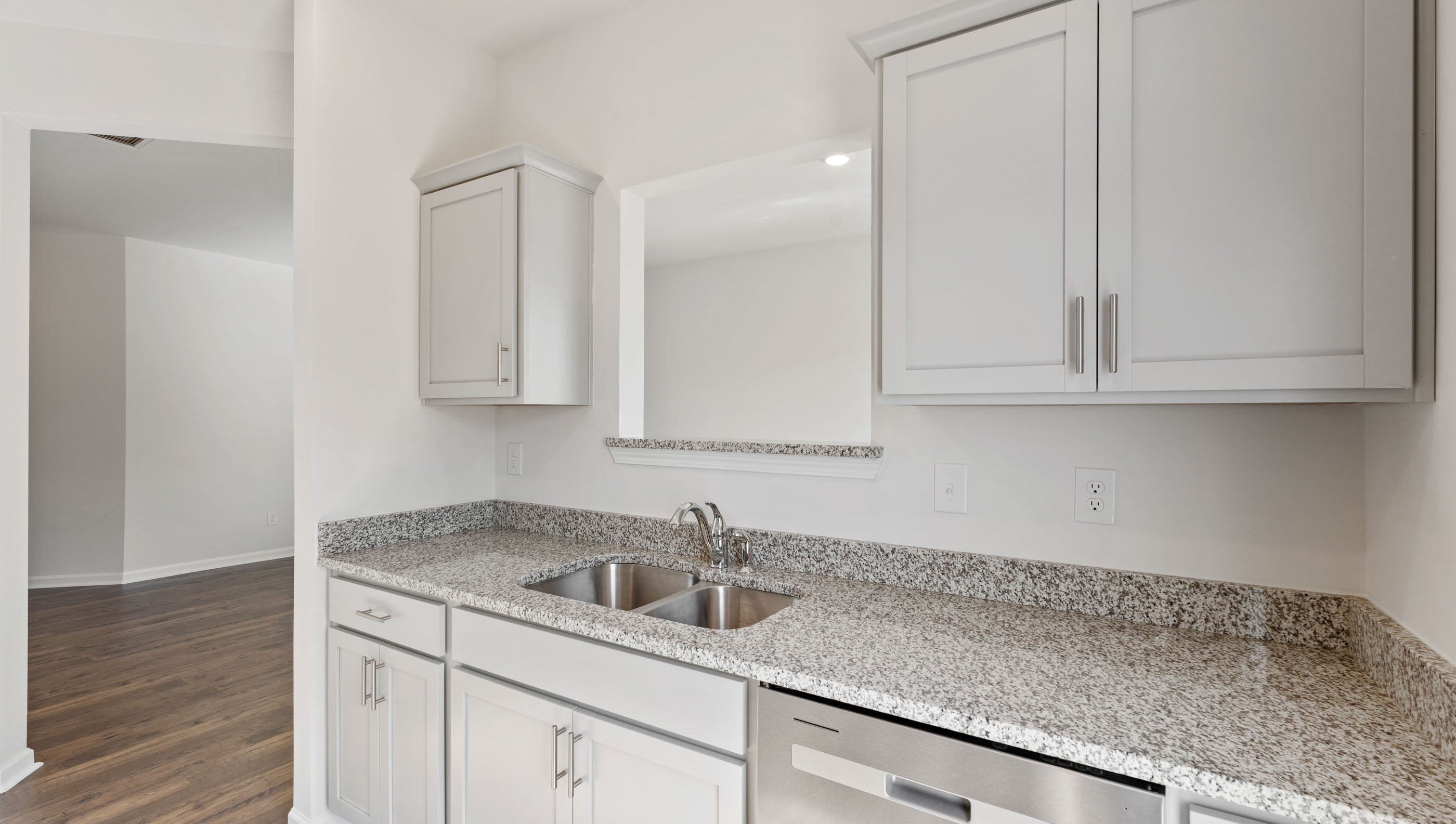 Kitchen with granite countertops and stainless steel appliances.