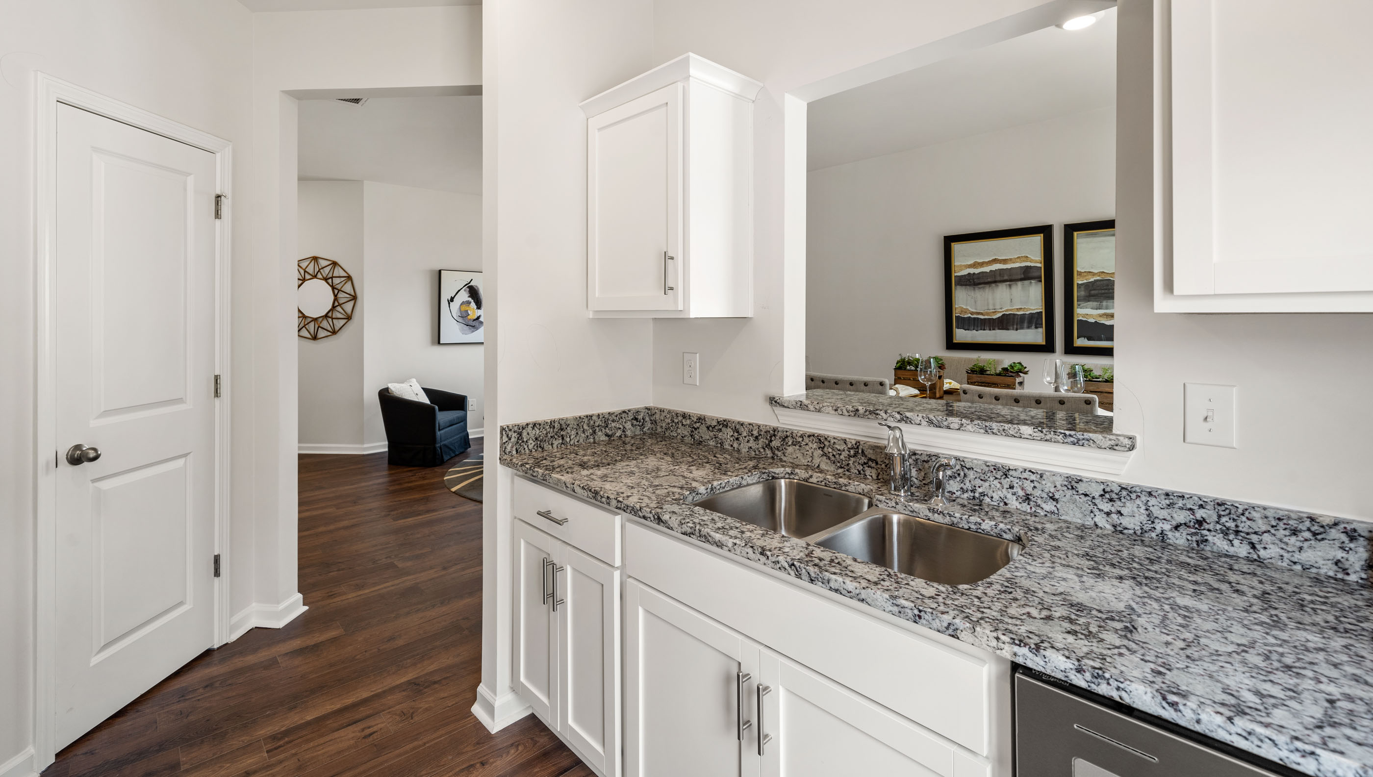 Kitchen and island with granite counter tops.