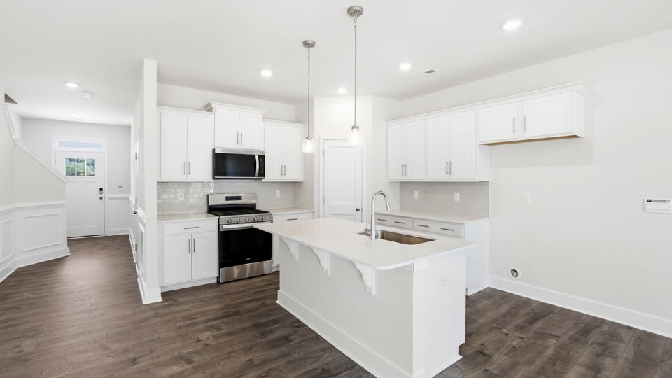Kitchen with island and cabinets.