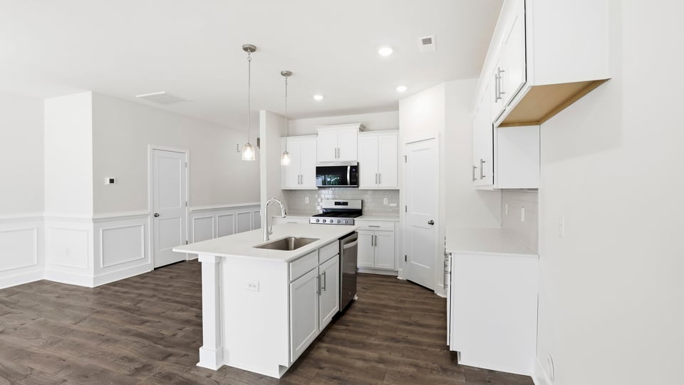 Kitchen with island and cabinets.