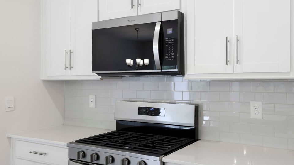 Kitchen with island and cabinets.