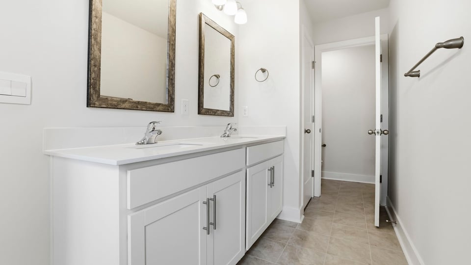 Primary bathroom with double vanity sink.