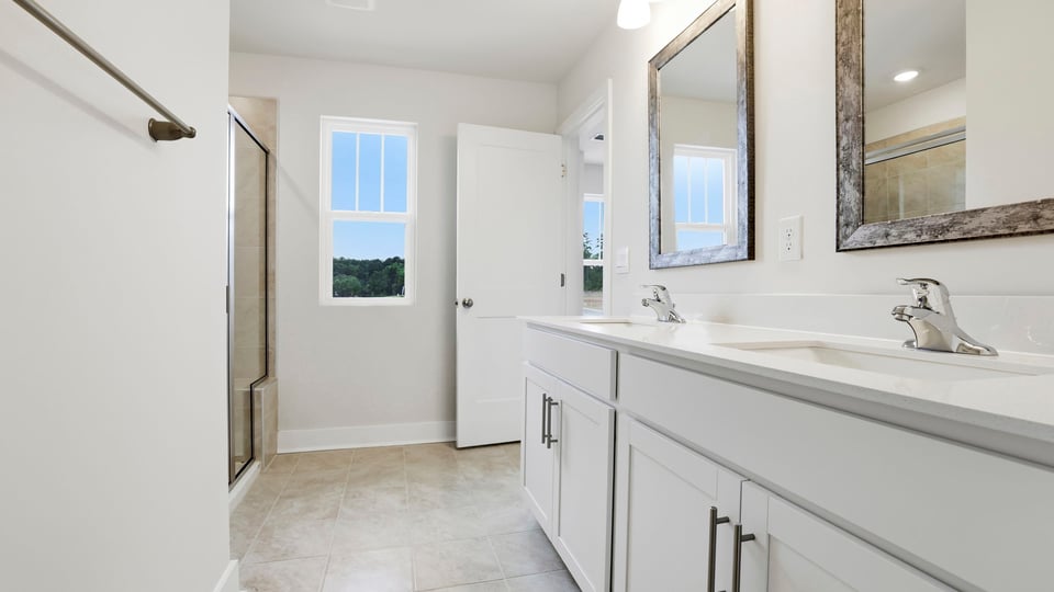 Primary bathroom with double vanity sink.