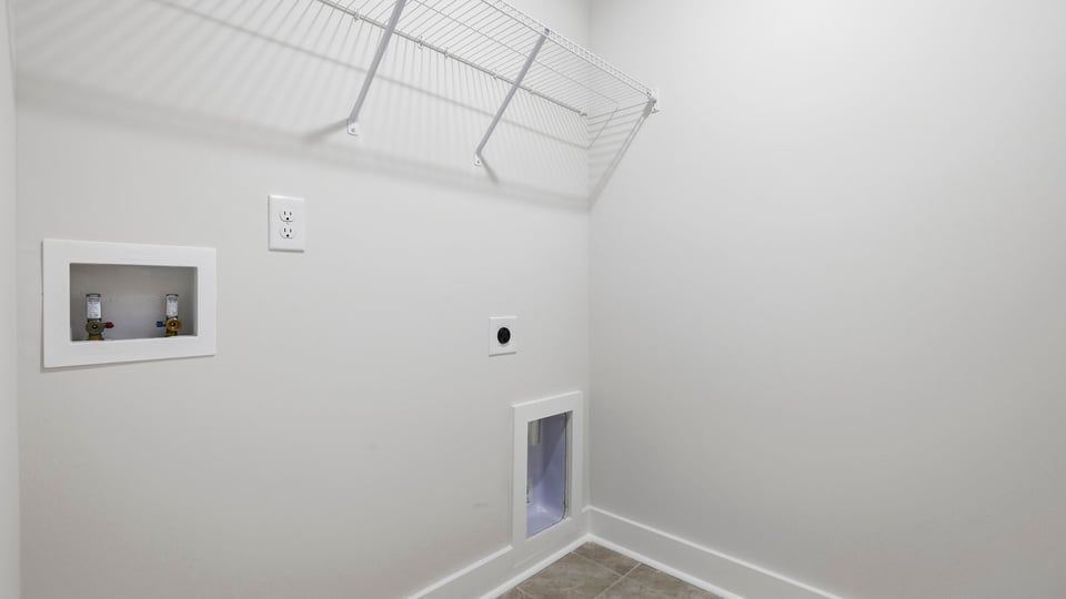 Laundry room with shelf.