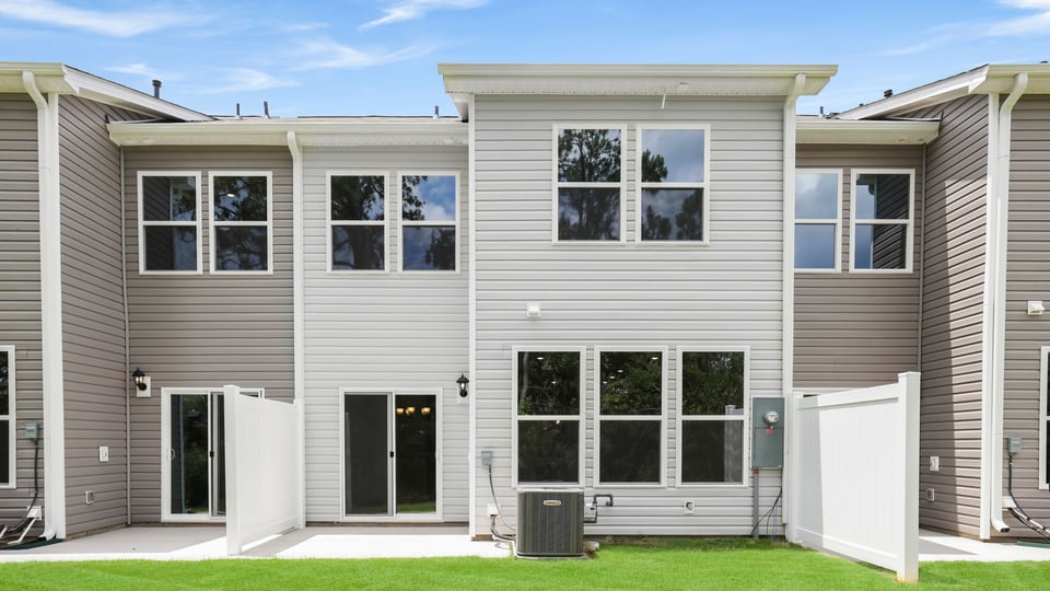 Back exterior with large backyard.