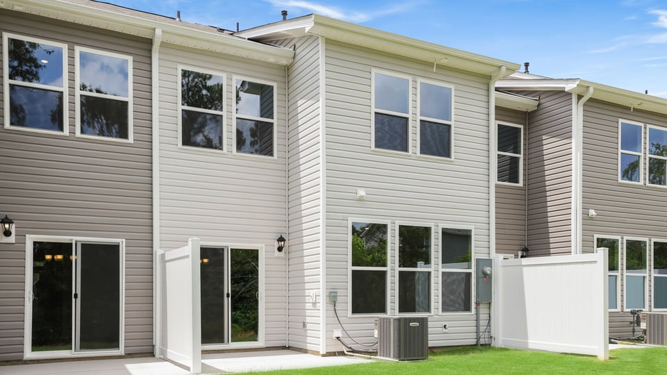 Back exterior with large backyard.