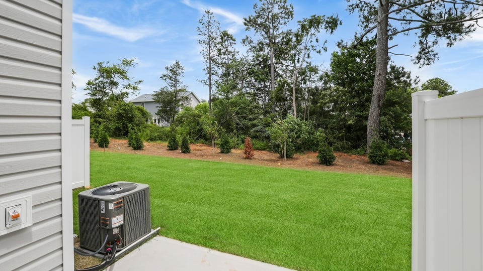 Back exterior with large backyard.