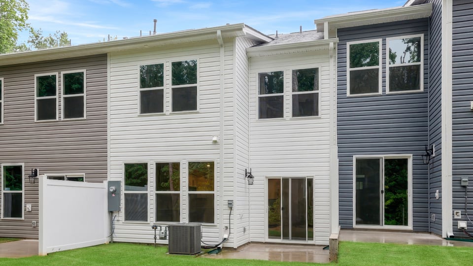 Back exterior with large backyard.