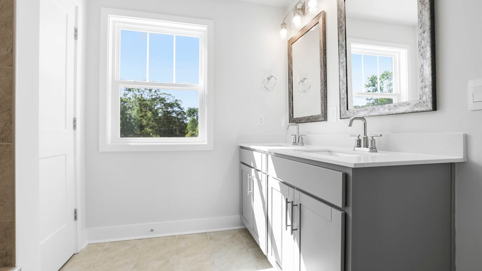 Primary bathroom with double vanity sinks.