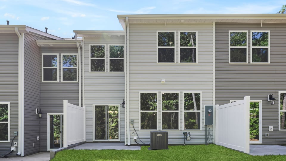 Back exterior with large backyard.