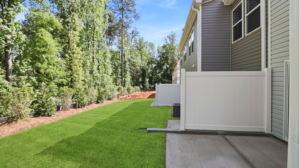 Back exterior with large backyard.