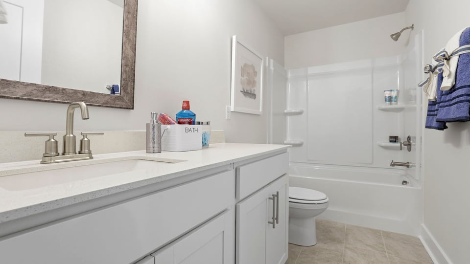 Primary bathroom with double vanity sinks.