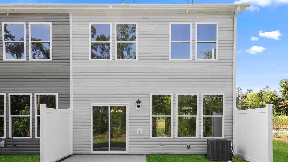 Back exterior with large backyard.