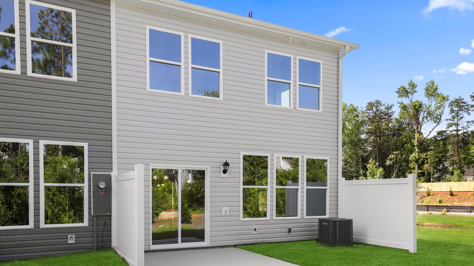 Back exterior with large backyard.
